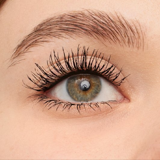 Close-up of eye with Maybelline Lash Sensational Firework Washable mascara applied, showing lifted and voluminous lashes.